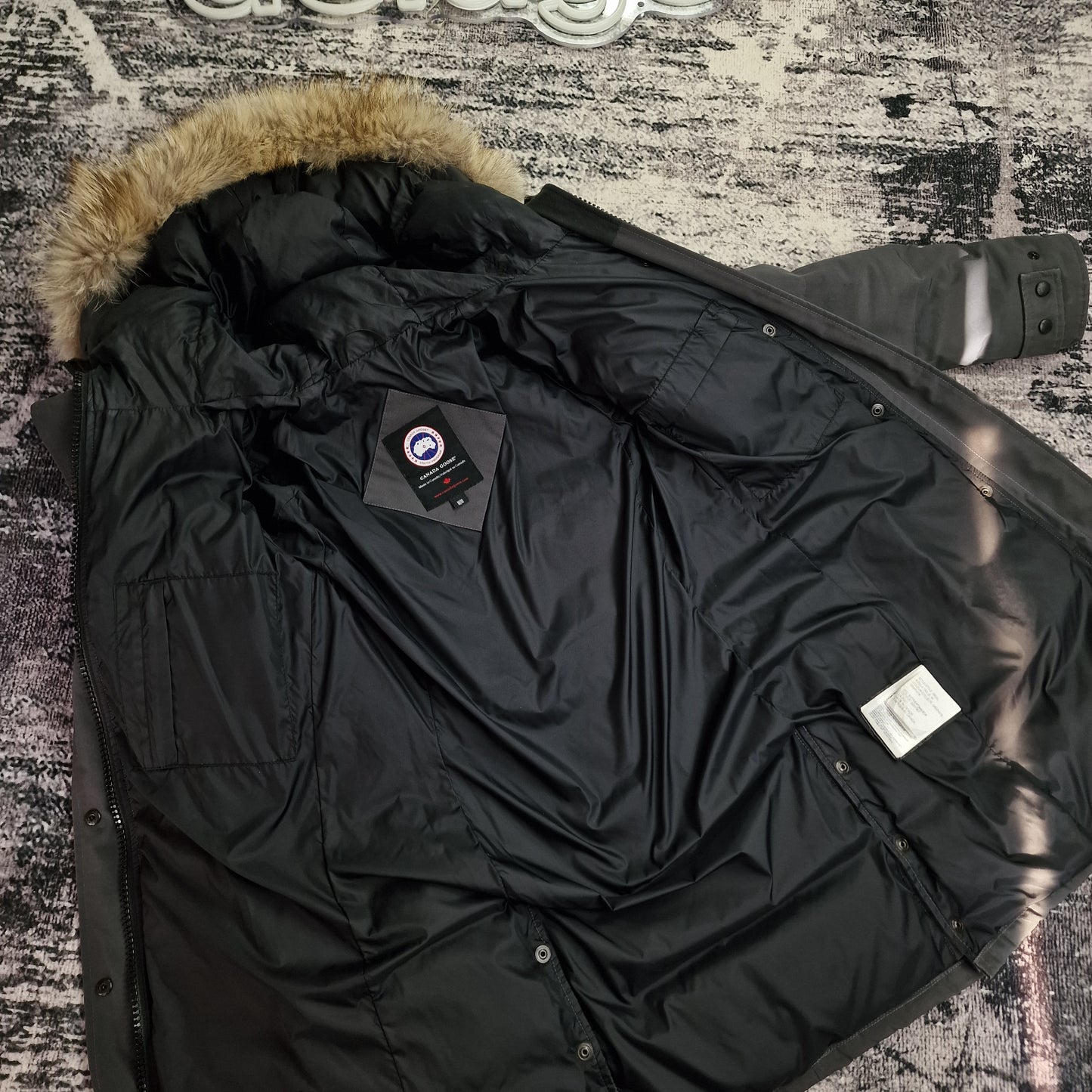 Interior lining view of Canada Goose Mackenzie Parka Medium showing inside pockets and construction, women's Graphite grey coat comparable to Shelburne Parka