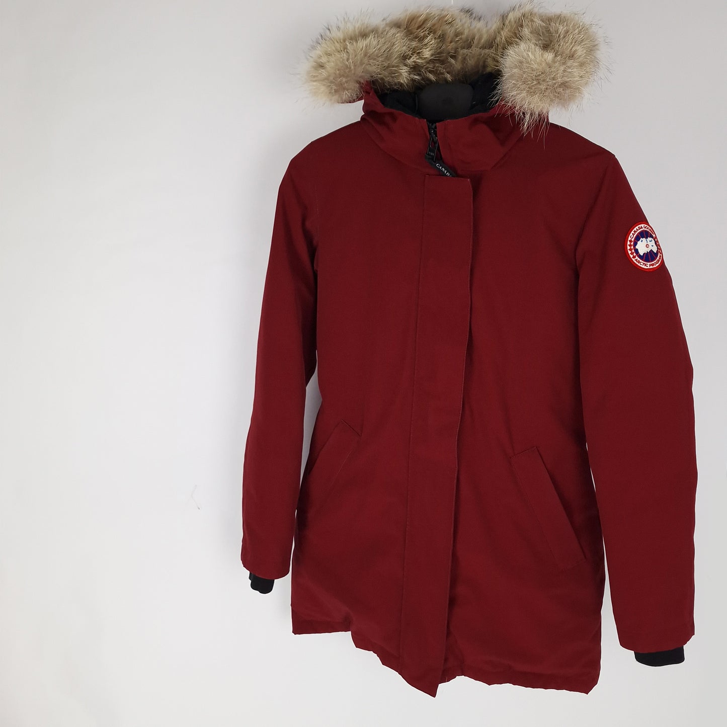 Professional product photo of Canada Goose Victoria Parka in Niagara Grape burgundy, women's luxury down-filled winter coat with fur hood, size Small, full jacket view
