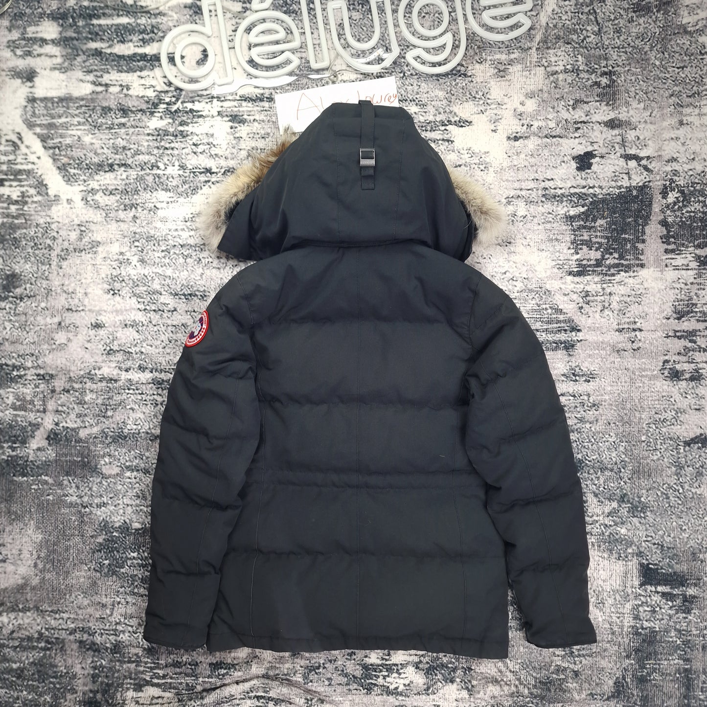 Back view flat lay of black Canada Goose Chelsea Parka 3804L women's size small with coyote fur hood trim and Arctic disc badge