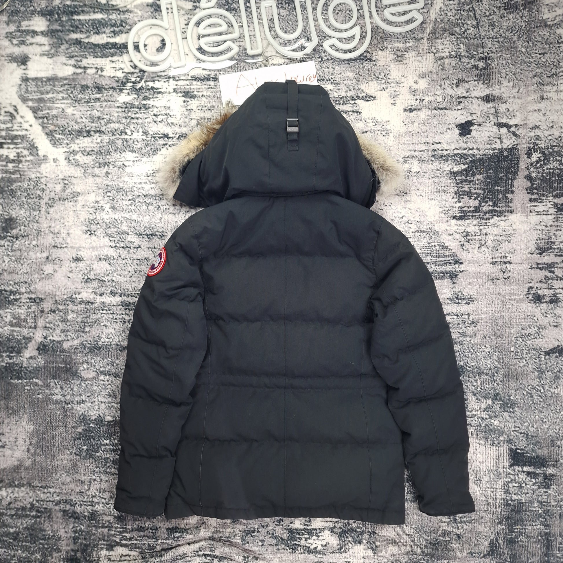 Back view flat lay of black Canada Goose Chelsea Parka 3804L women's size small with coyote fur hood trim and Arctic disc badge
