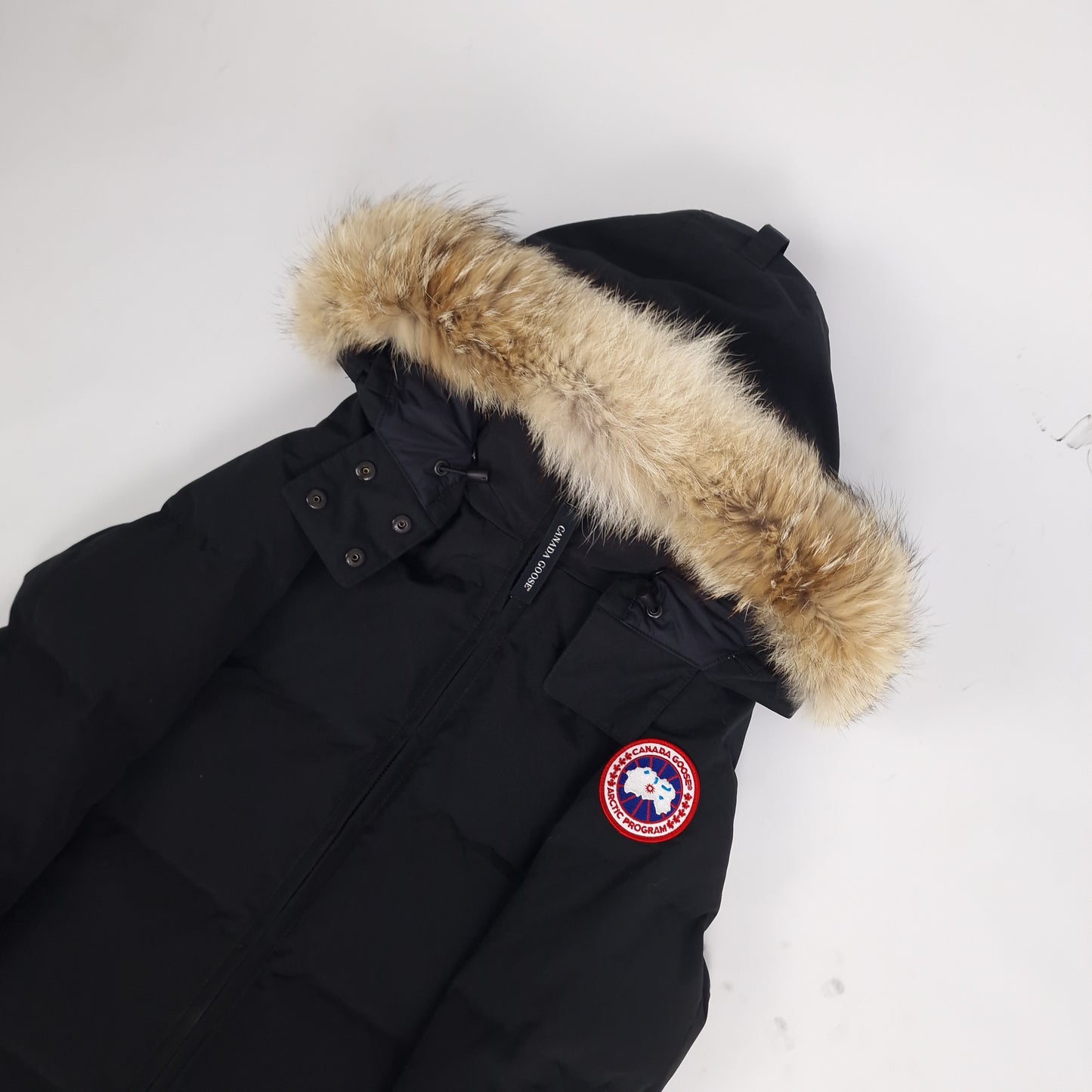Canada Goose Chelsea Parka Black XS Women's side angle showing coyote fur trim hood and iconic arm badge. Authentic luxury winter coat. Premium outerwear.