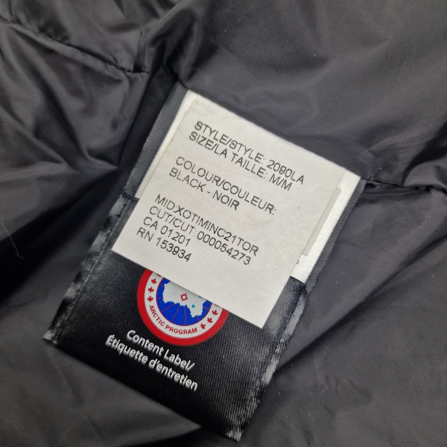 Style tag detail of Canada Goose Lorette Parka 2090LA showing black color and size medium specifications