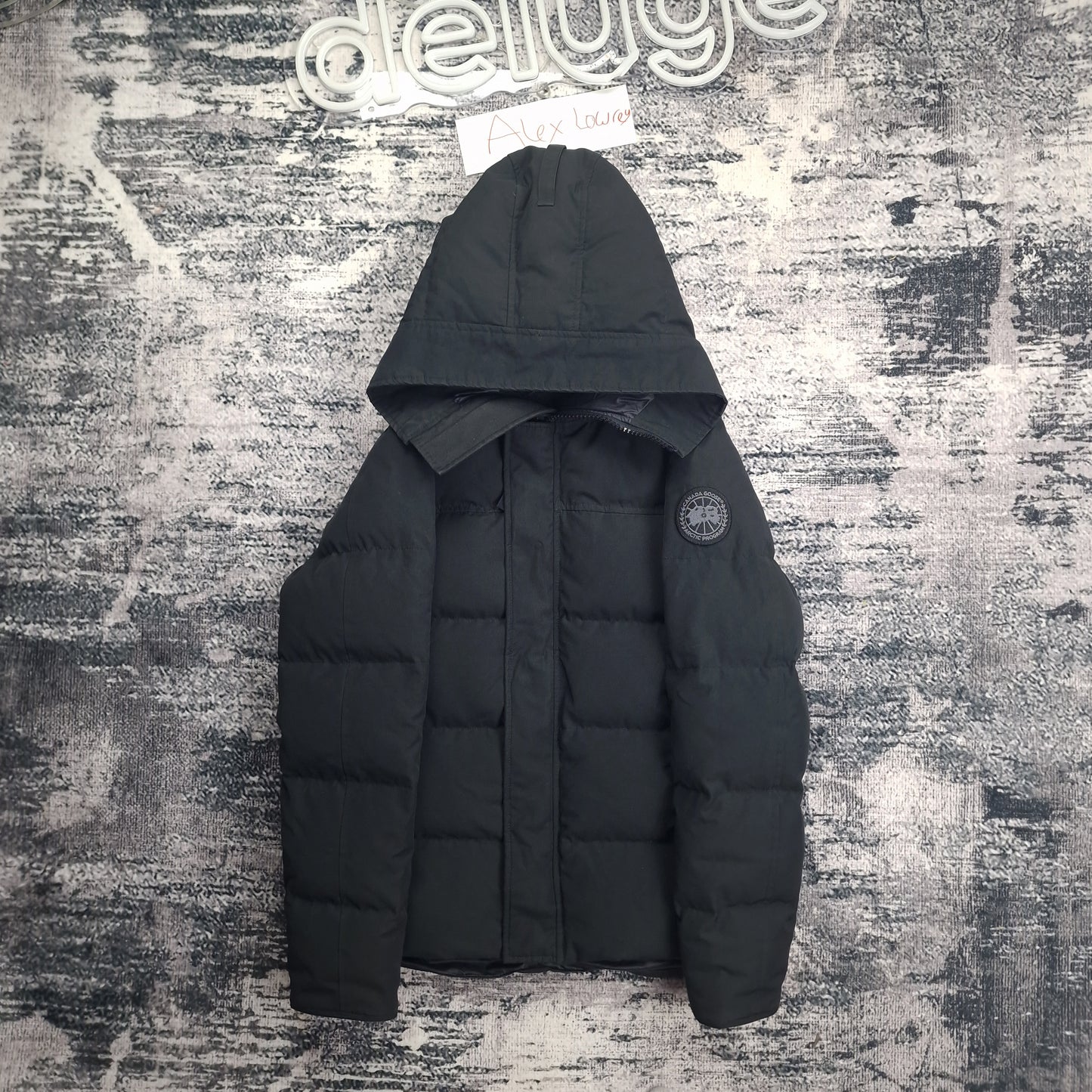 Front flat lay of Canada Goose Macmillan Black Label Parka 3804MB men's medium featuring tonal black badge and hood