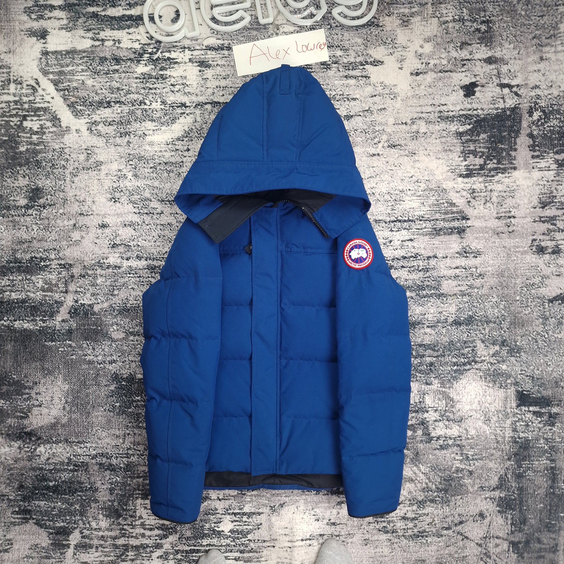 Front flat lay of Northern Night blue Canada Goose Macmillan Parka men's medium with Arctic disc badge and chest pockets