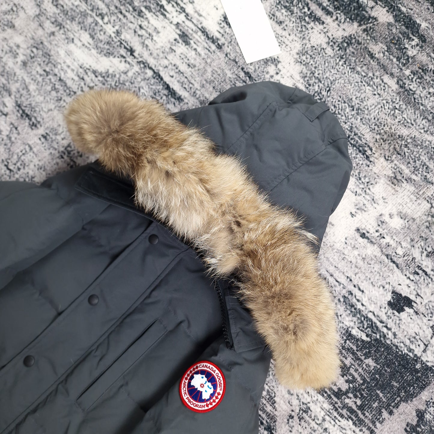 Canada Goose Carson Parka Graphite Men's Side View Showing Fur Hood and Badge Detail