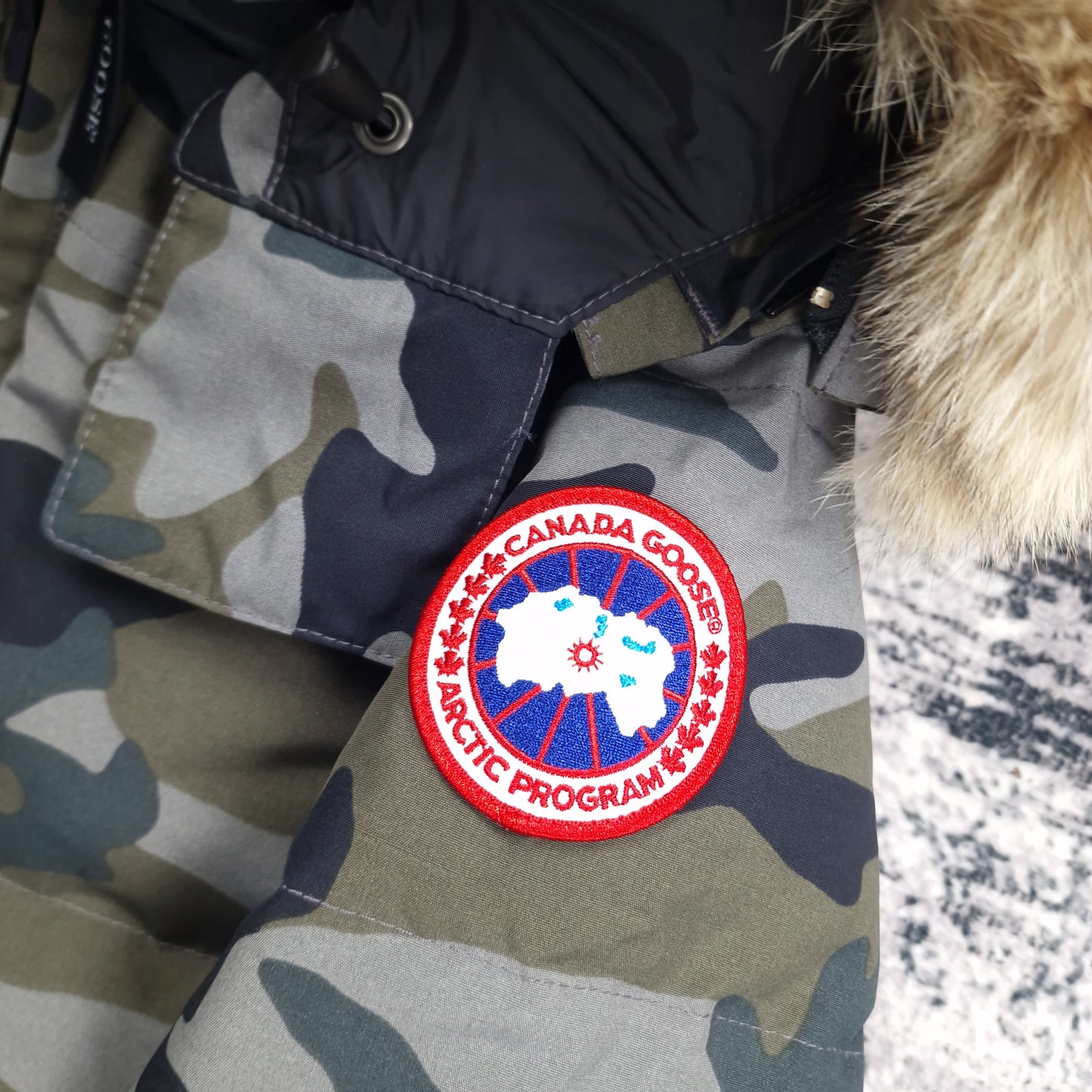 Canada Goose Badge Close-Up Detail on Chelsea Parka Heritage Classic Camo Women's