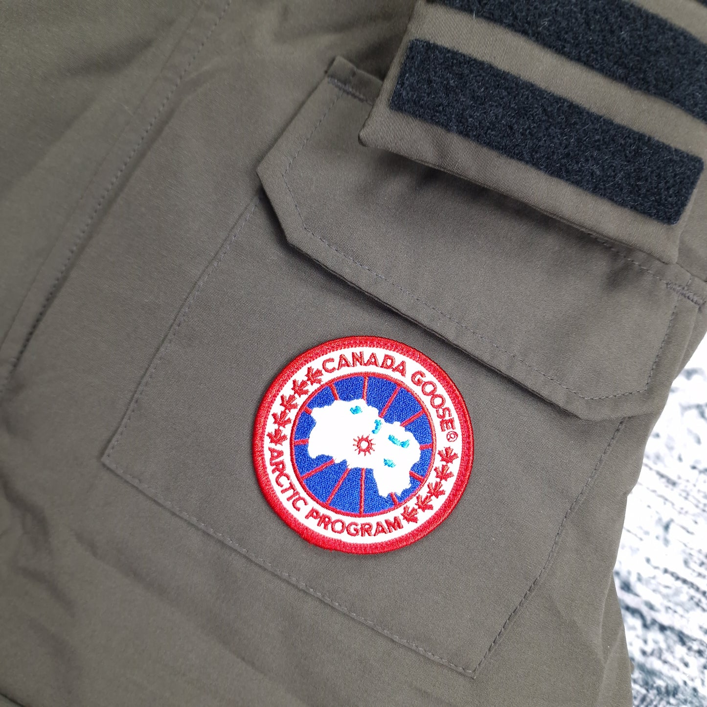 Canada Goose Badge Close-Up Detail on Hudson Vest Earth Green Men's