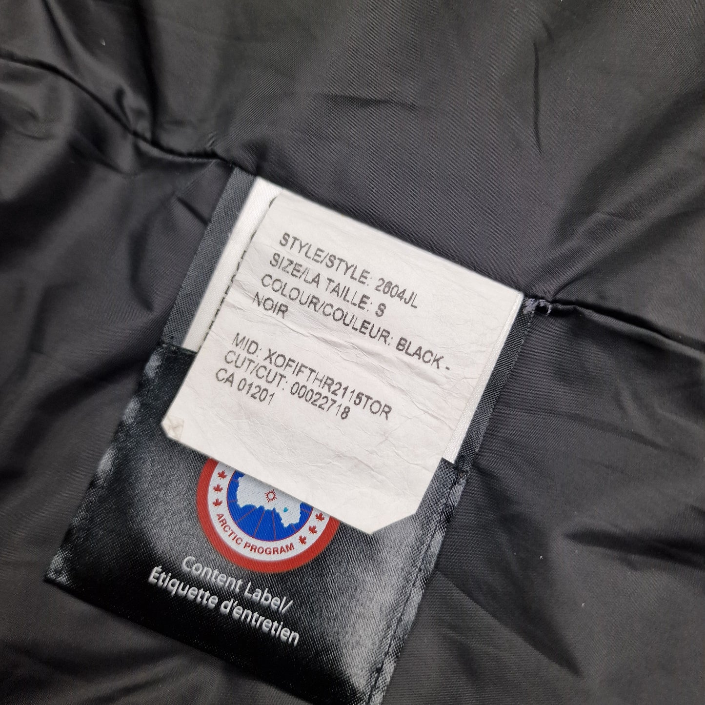 Canada Goose Portland Parka White Wash Tag Close-Up with Size and Color Code Details