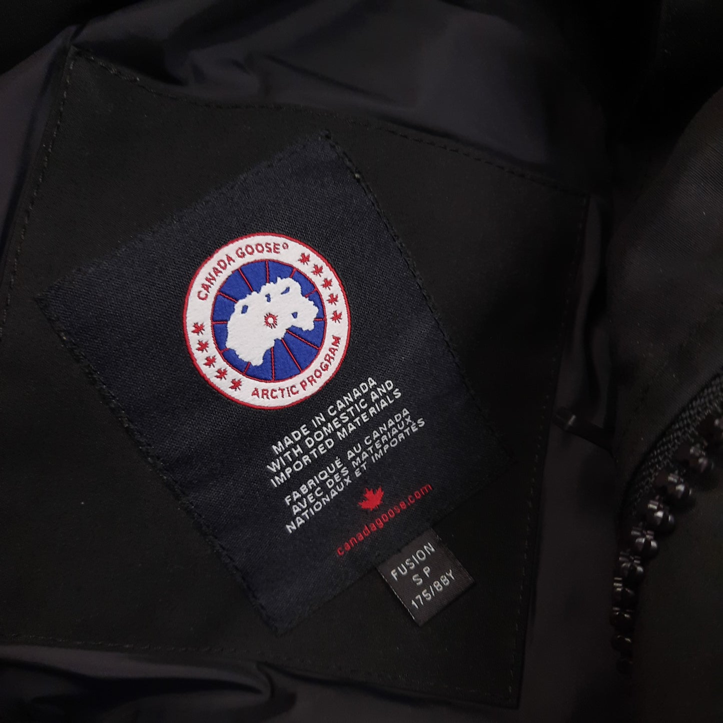 Canada Goose Wyndham Parka Heritage Neck Tag Close-Up Showing Size Label
