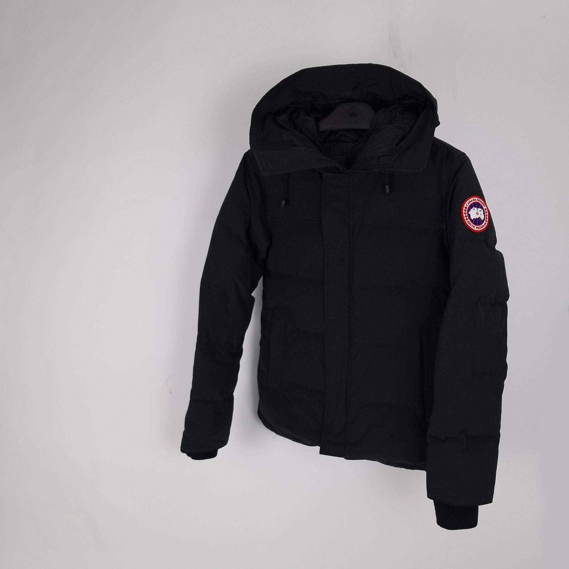 Three-quarter view of Canada Goose Macmillan men's parka style 3804MA in black, size small, displaying sleek urban design and signature logo patch