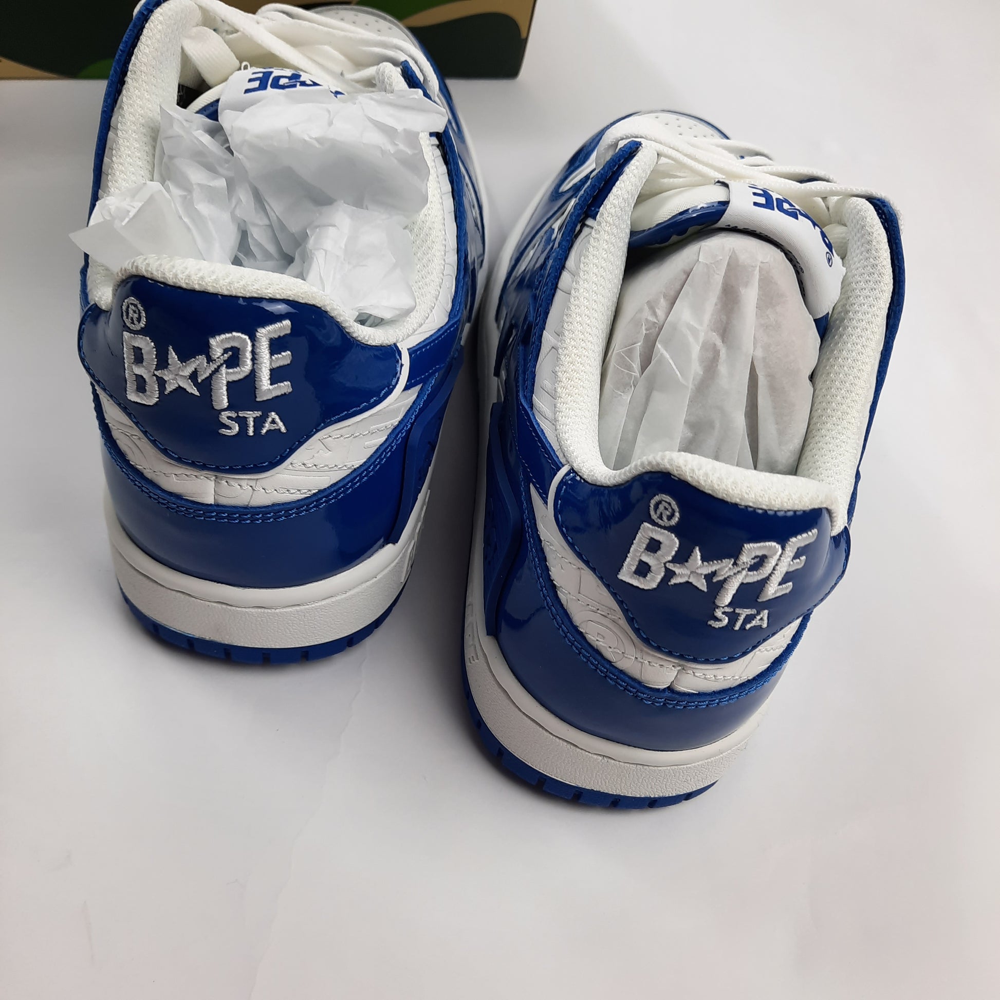 Back heel view of BAPE Bapesta sneakers showing BAPE STA branding, blue and white colorway UK size 8