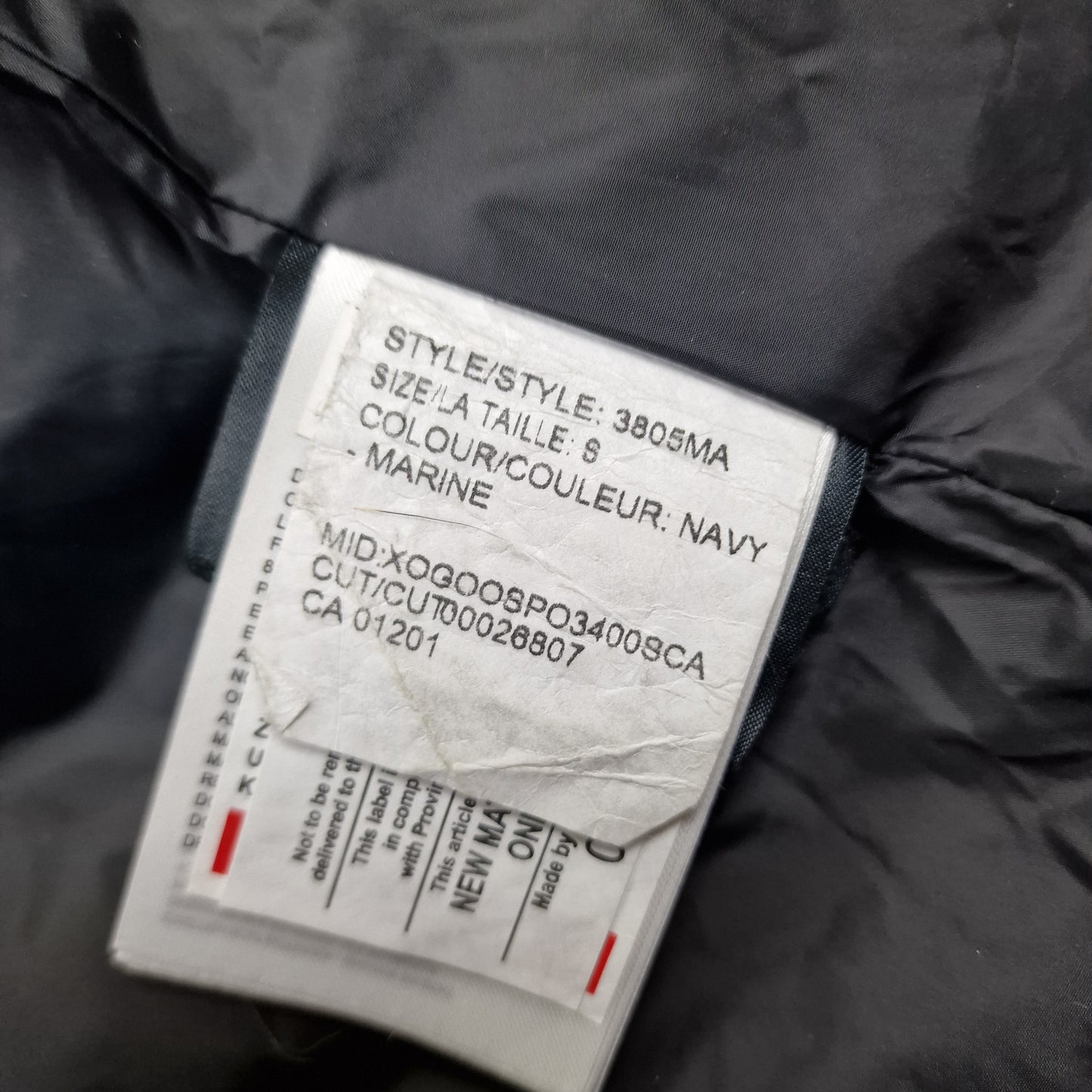 White care label washtag showing style code 3805MA, navy color designation, and size Small information for authentic Canada Goose Carson Parka men's winter jacket