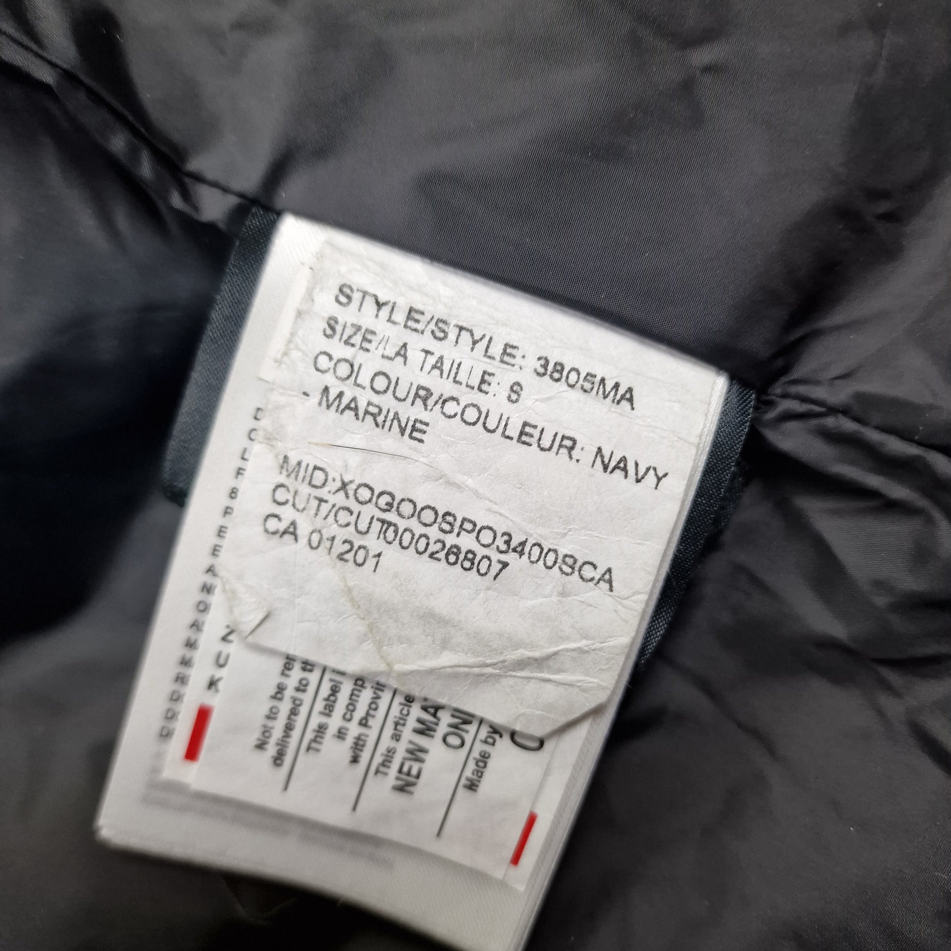 White care label washtag showing style code 3805MA, navy color designation, and size Small information for authentic Canada Goose Carson Parka men's winter jacket