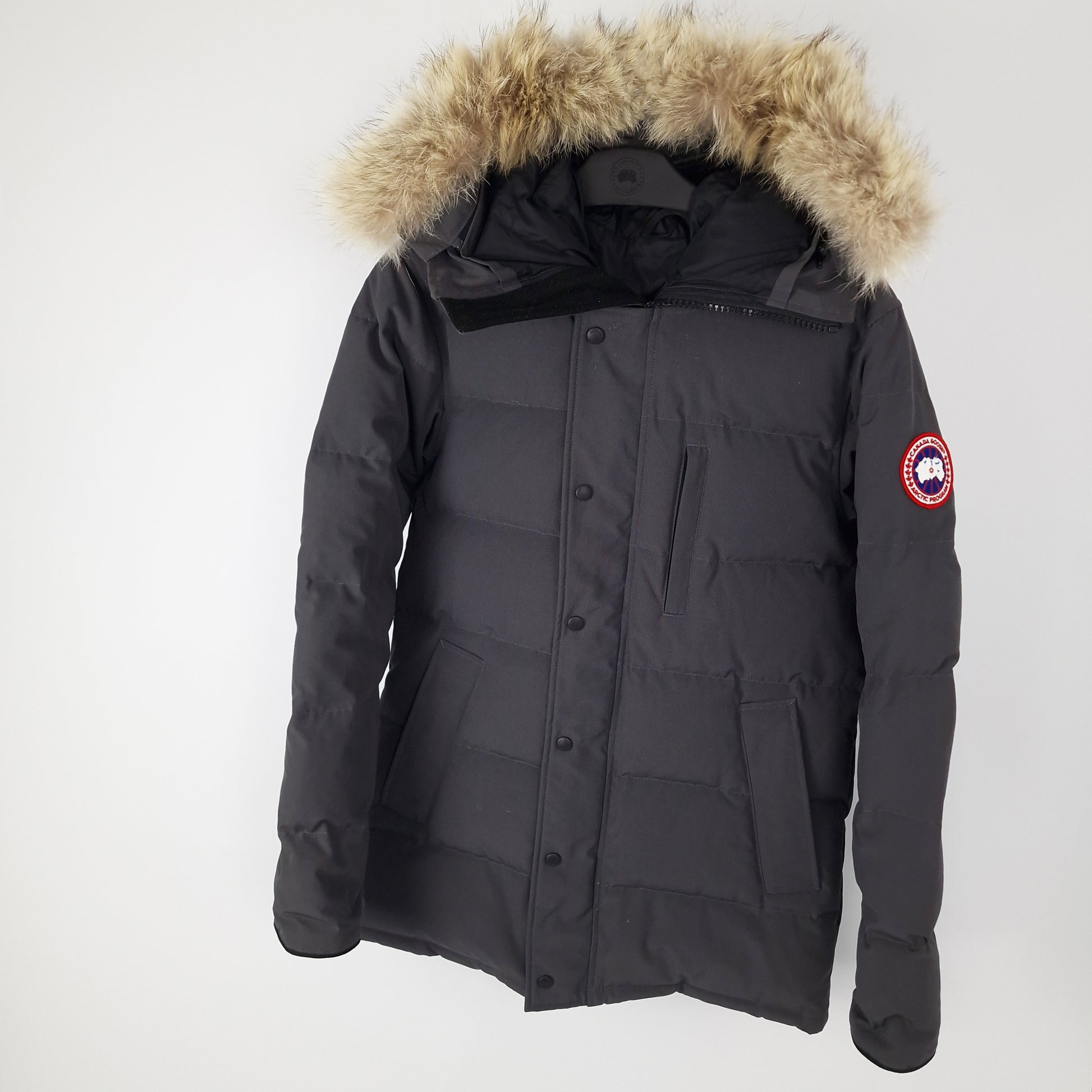 Professional product photo of Canada Goose Carson Parka in Graphite grey, men's luxury down-filled winter coat with fur hood, style 3805M Small, full jacket view