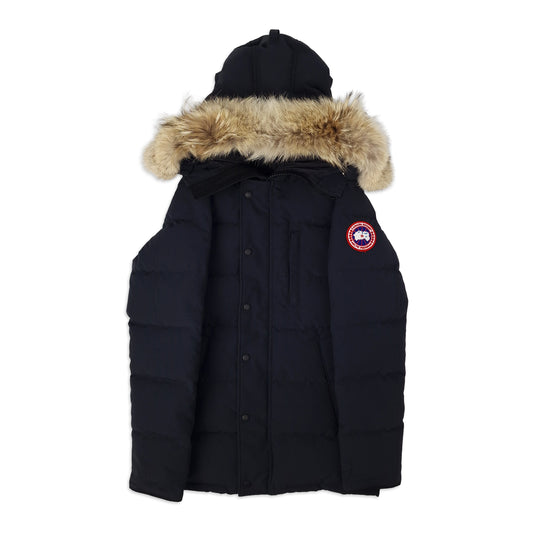 Front view of men's Canada Goose Carson Parka 3805MA size Small in classic navy with coyote fur-trimmed hood, displayed on white background