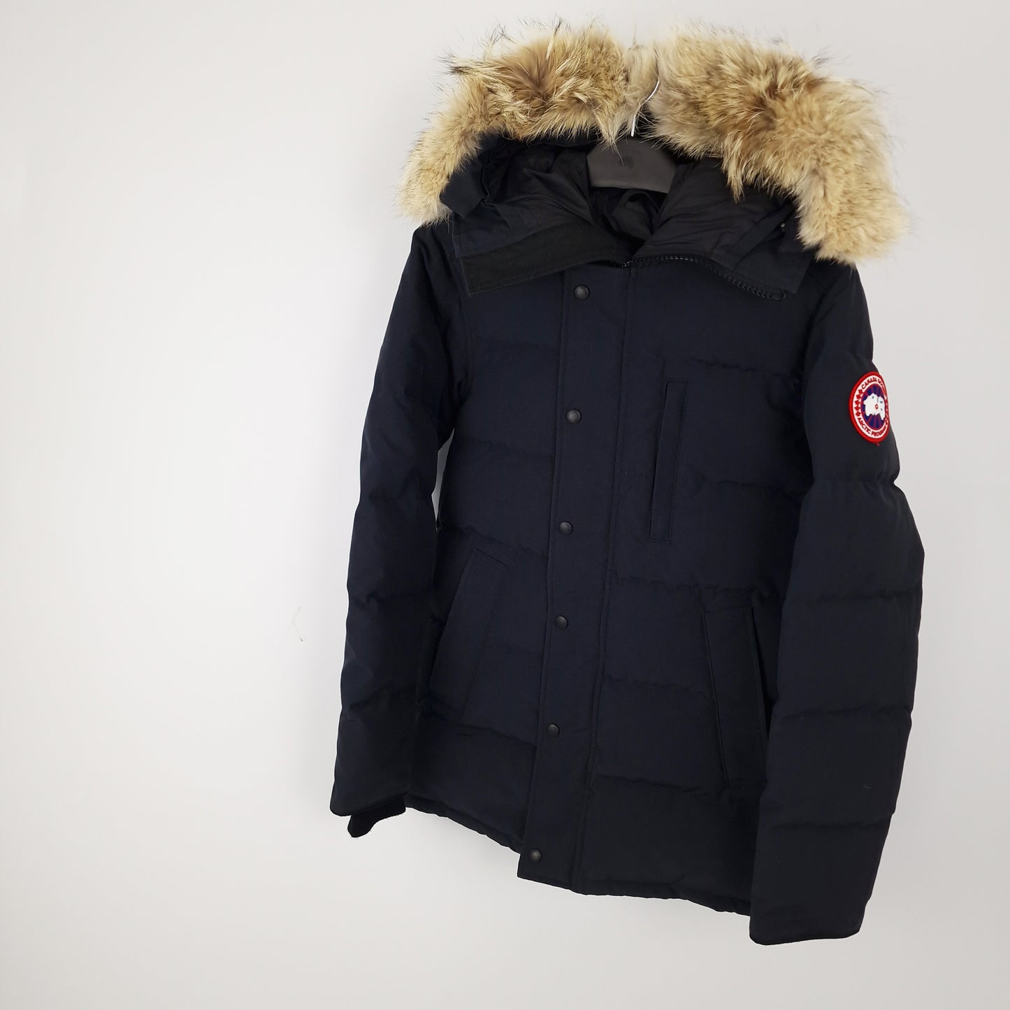 Professional product photo of Canada Goose Carson Parka in navy, men's luxury down-filled winter coat with fur hood, style 3805MA Small, full jacket view