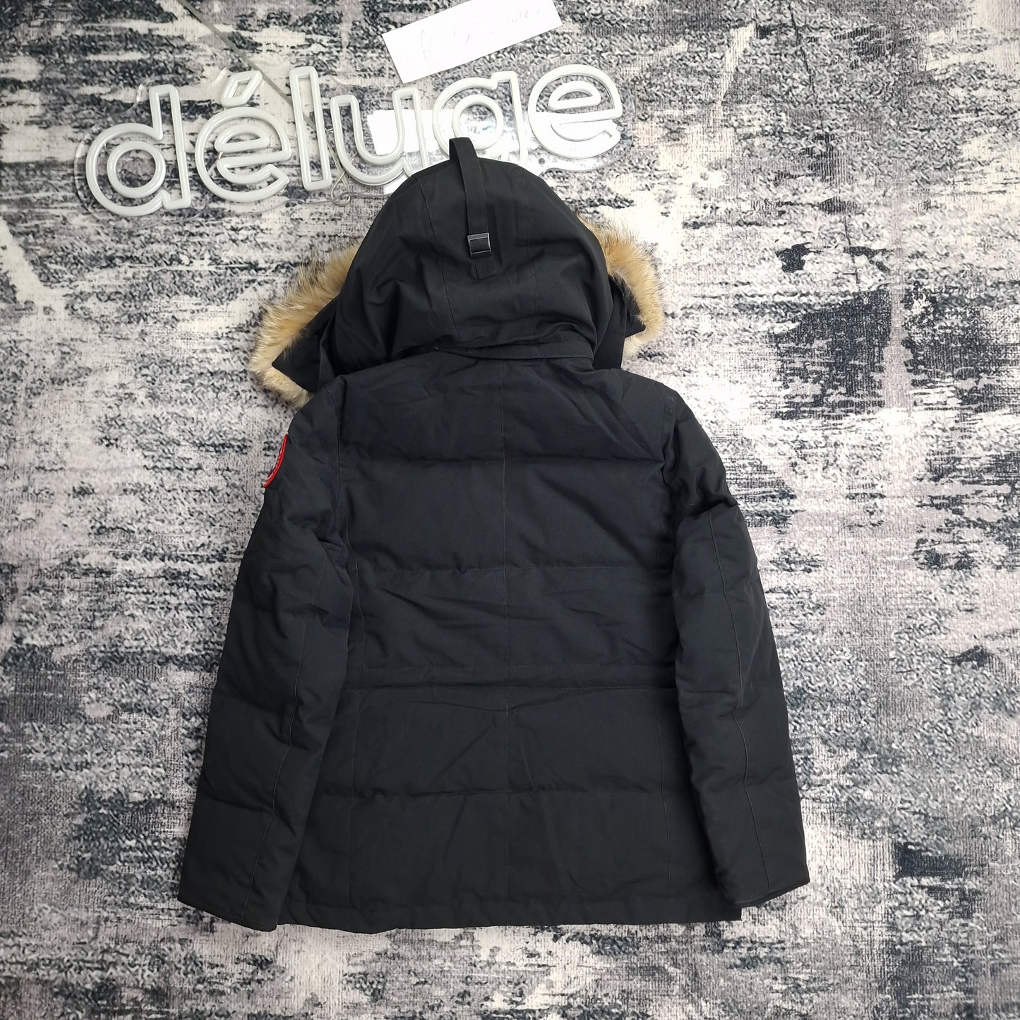 Back view of women's Canada Goose Chelsea Parka 3804LA Medium in black featuring Arctic Program patch, hip-length winter coat photographed on styled background