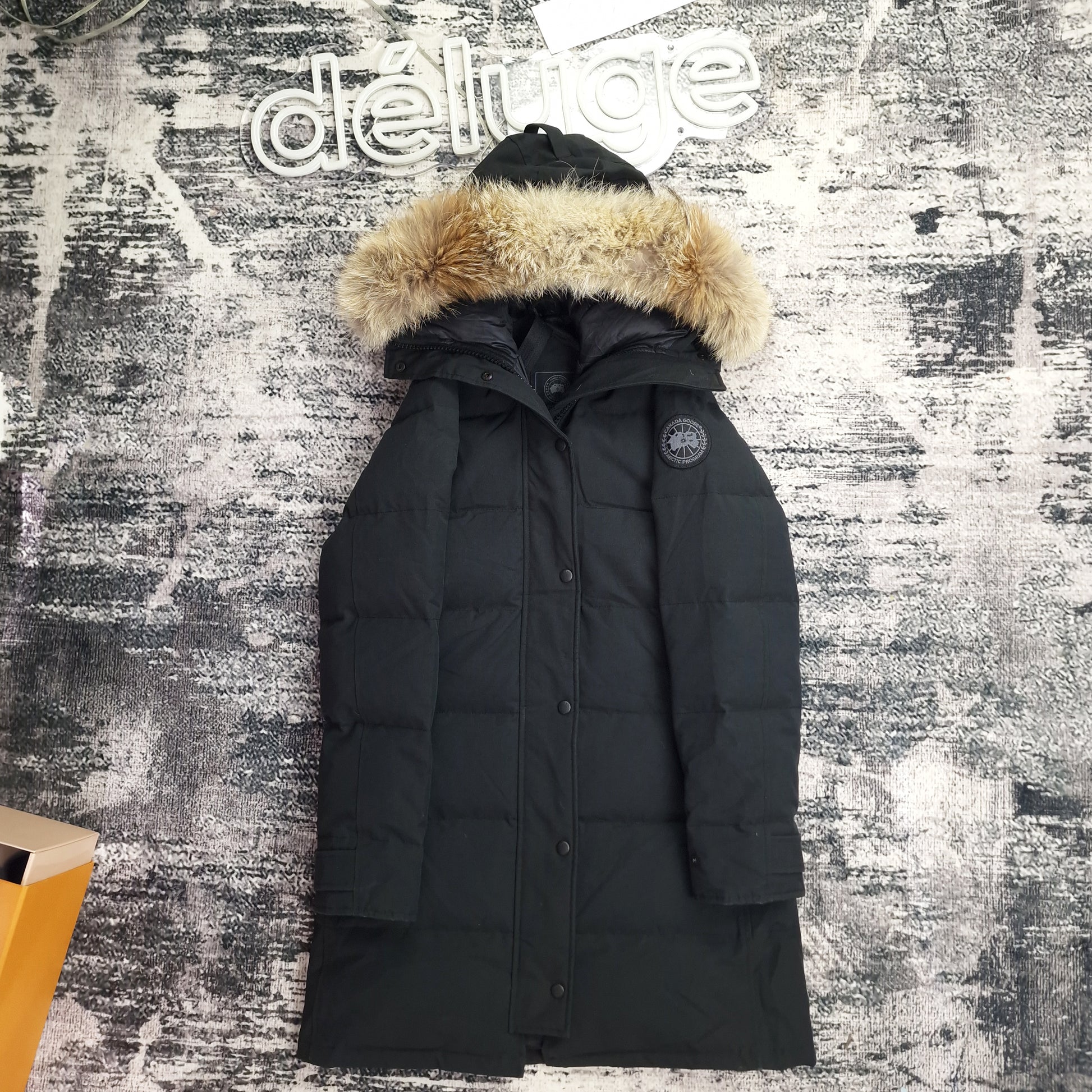 Front view of women's Canada Goose Shelburne Parka Black Label 3802LB Small in black with coyote fur-trimmed hood, luxury winter coat photographed on styled background