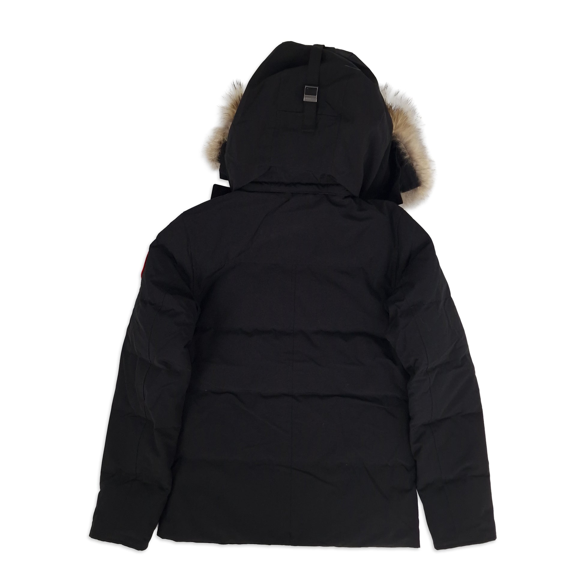 Back view of men's Canada Goose Wyndham Parka 3808MA XS in black showing signature Arctic Program patch and slim-fit silhouette, displayed on white background
