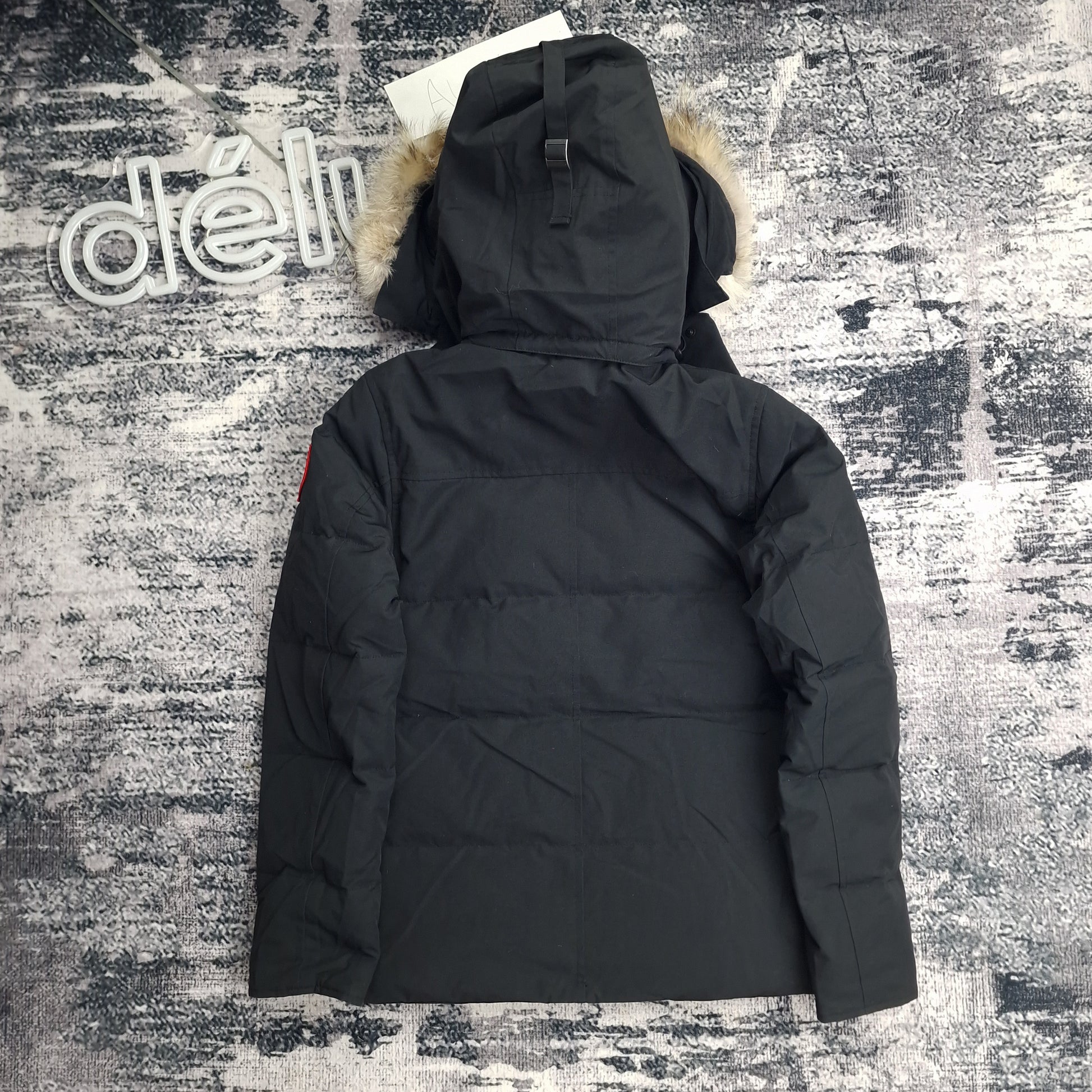 Back view of men's Canada Goose Wyndham Parka 3808MA XS in black featuring Arctic Program patch, slim-fit winter coat photographed on styled background