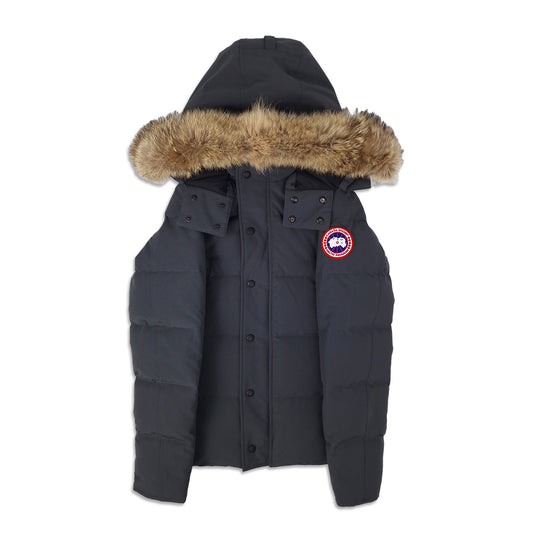 Front view of men's Canada Goose Wyndham Parka 3808MA size XS in Graphite grey with coyote fur-trimmed hood, displayed on white background