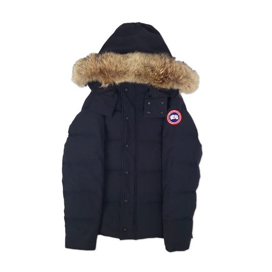 Front view of men's Canada Goose Wyndham Parka 3808MA size Large in classic navy with coyote fur-trimmed hood, displayed on white background