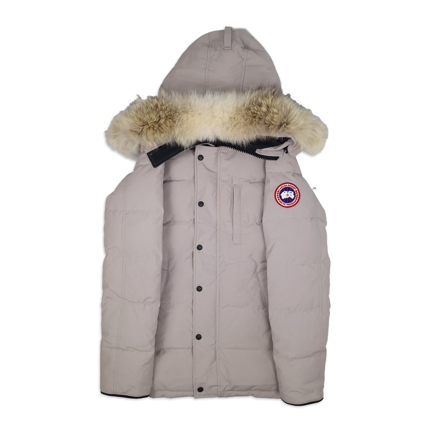 Front view of Canada Goose Carson Parka 3805M men's small in limestone with fur hood, Arctic badge, and thigh-length coverage