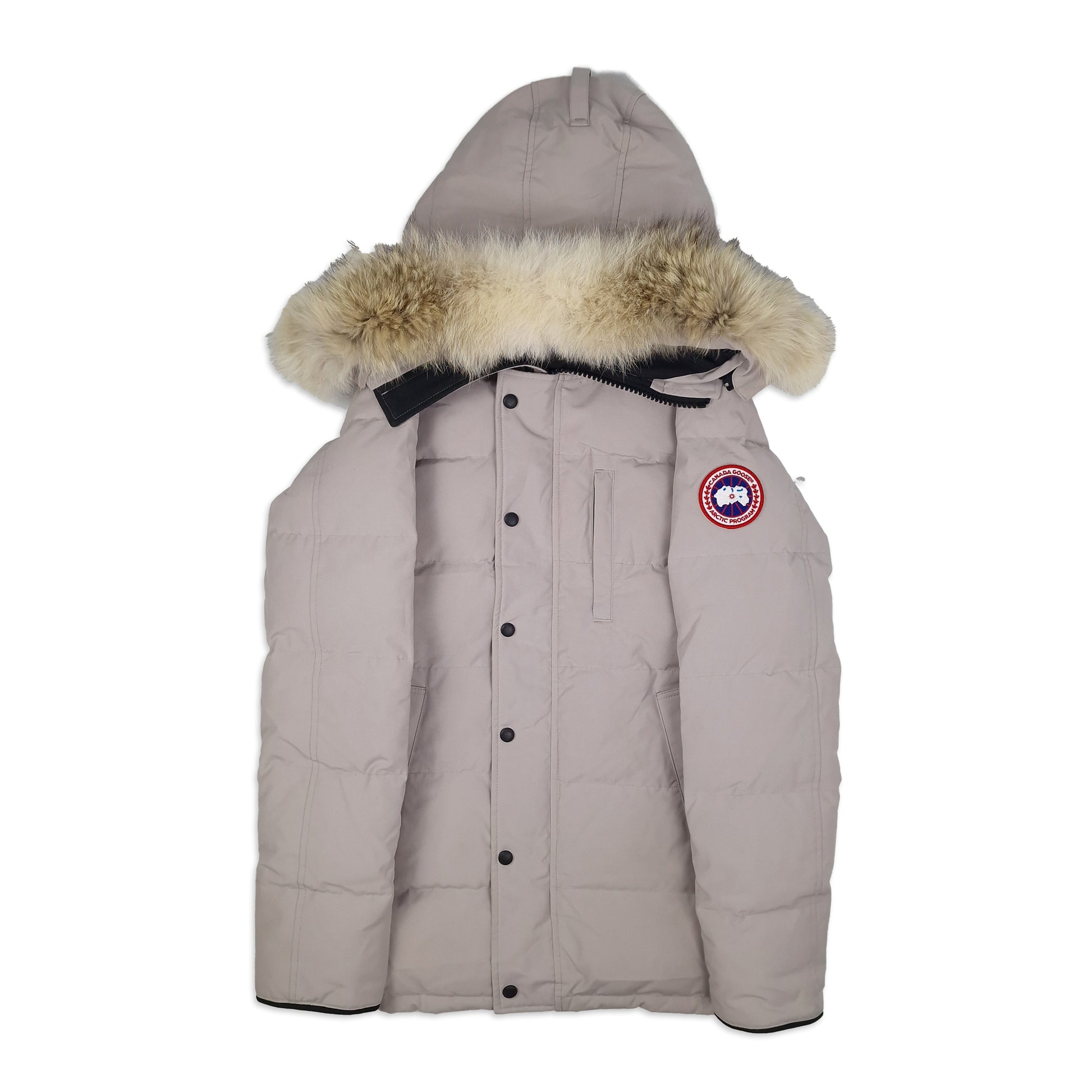Front view of Canada Goose Carson Parka 3805M men's small in limestone with fur hood, Arctic badge, and thigh-length coverage