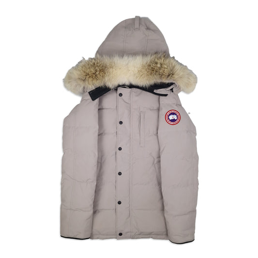 Front view of Canada Goose Carson Parka 3805M men's small in limestone with fur hood, Arctic badge, and thigh-length coverage