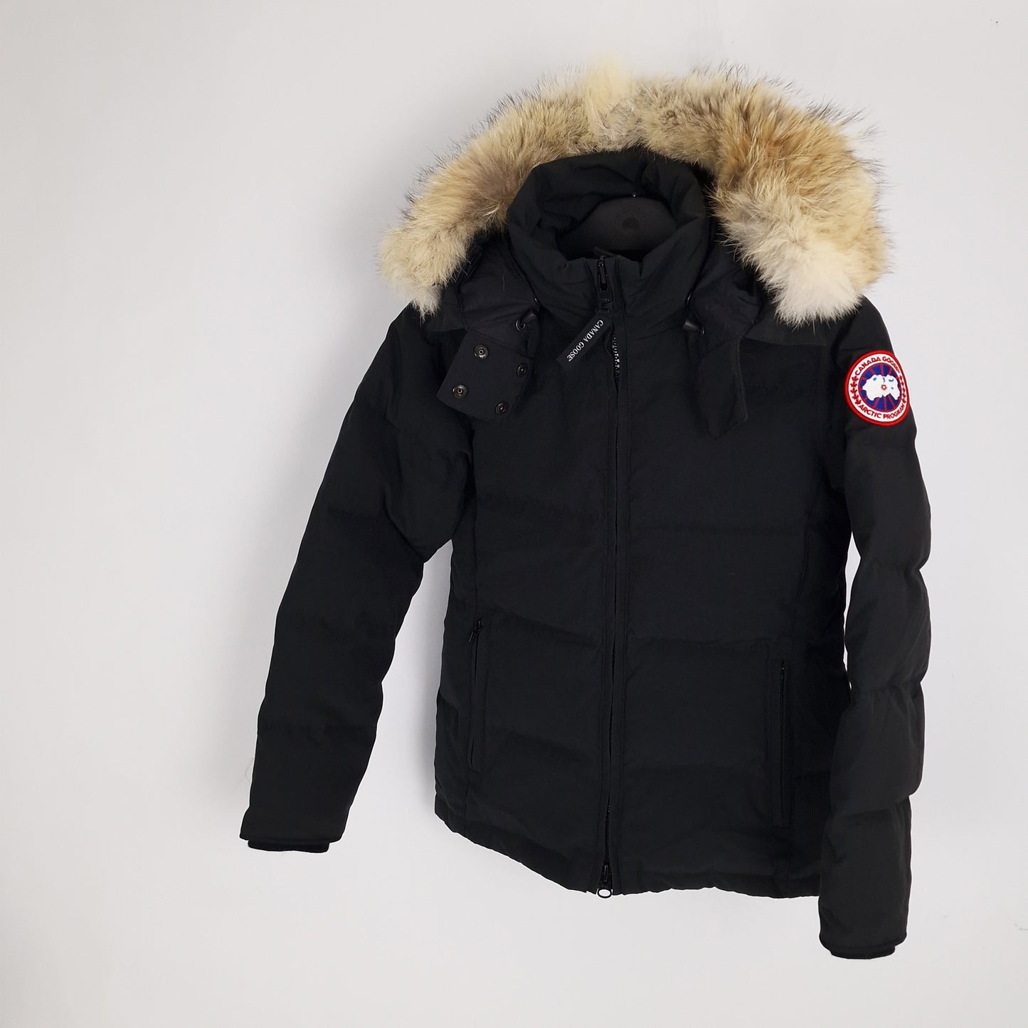 Angled view of Canada Goose Chelsea Parka 3804LA women's small displaying coyote fur hood trim and tailored mid-length fit