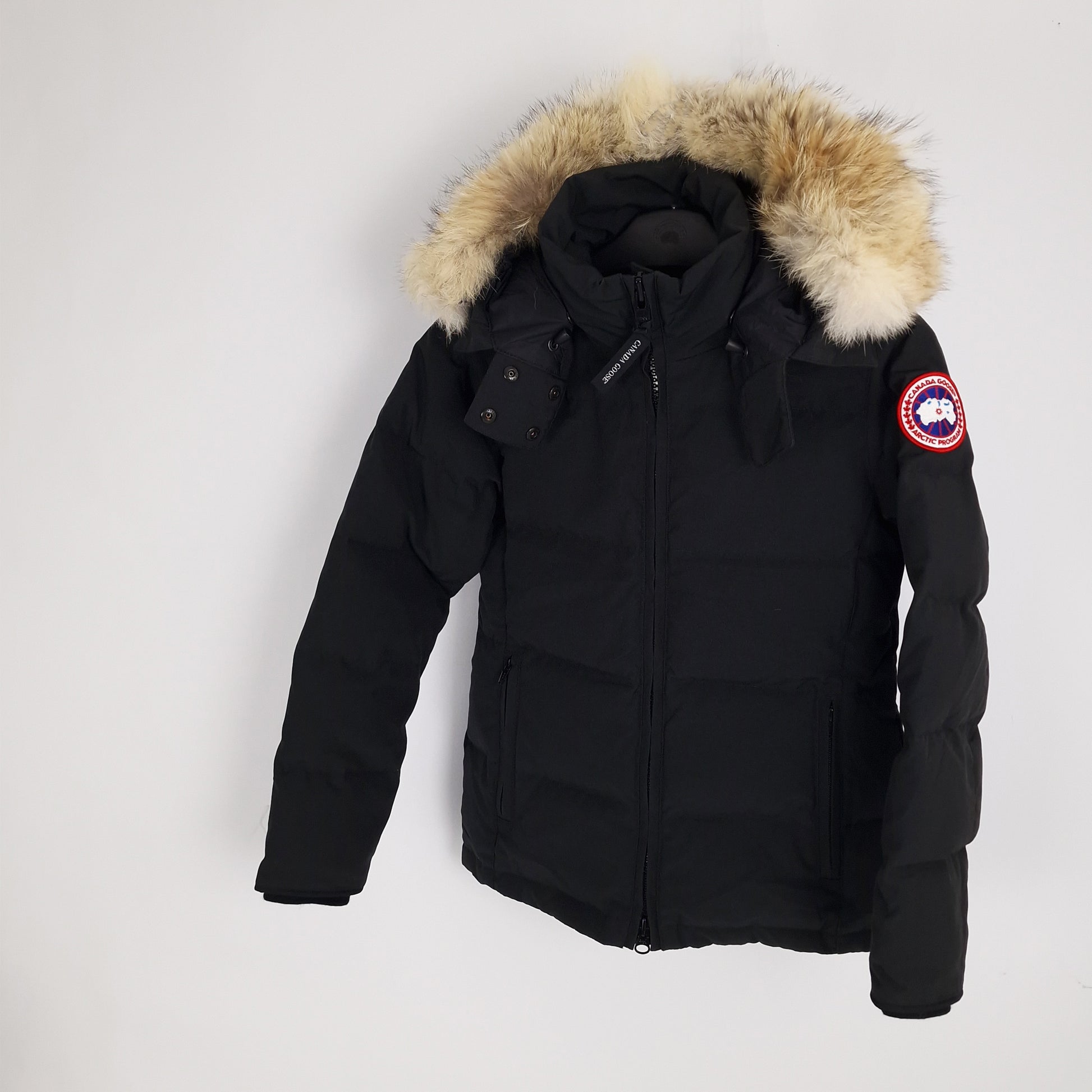 Angled view of Canada Goose Chelsea Parka 3804LA women's small displaying coyote fur hood trim and tailored mid-length fit