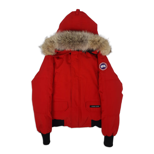 Front flat lay of red Canada Goose Chilliwack bomber jacket size small with fur-trimmed hood and iconic Arctic disc patch