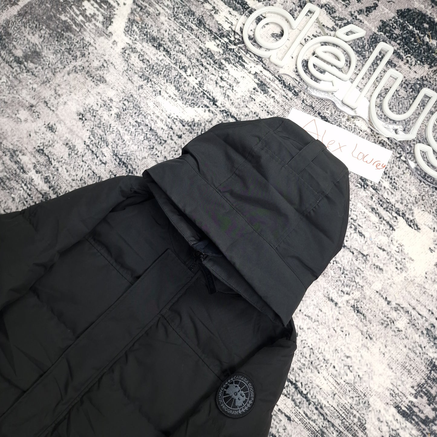 Men's Canada Goose Macmillan Black Label parka 2080MB in black, size small, shown folded with hood detail and exclusive Black Label Arctic Program badge on sleeve
