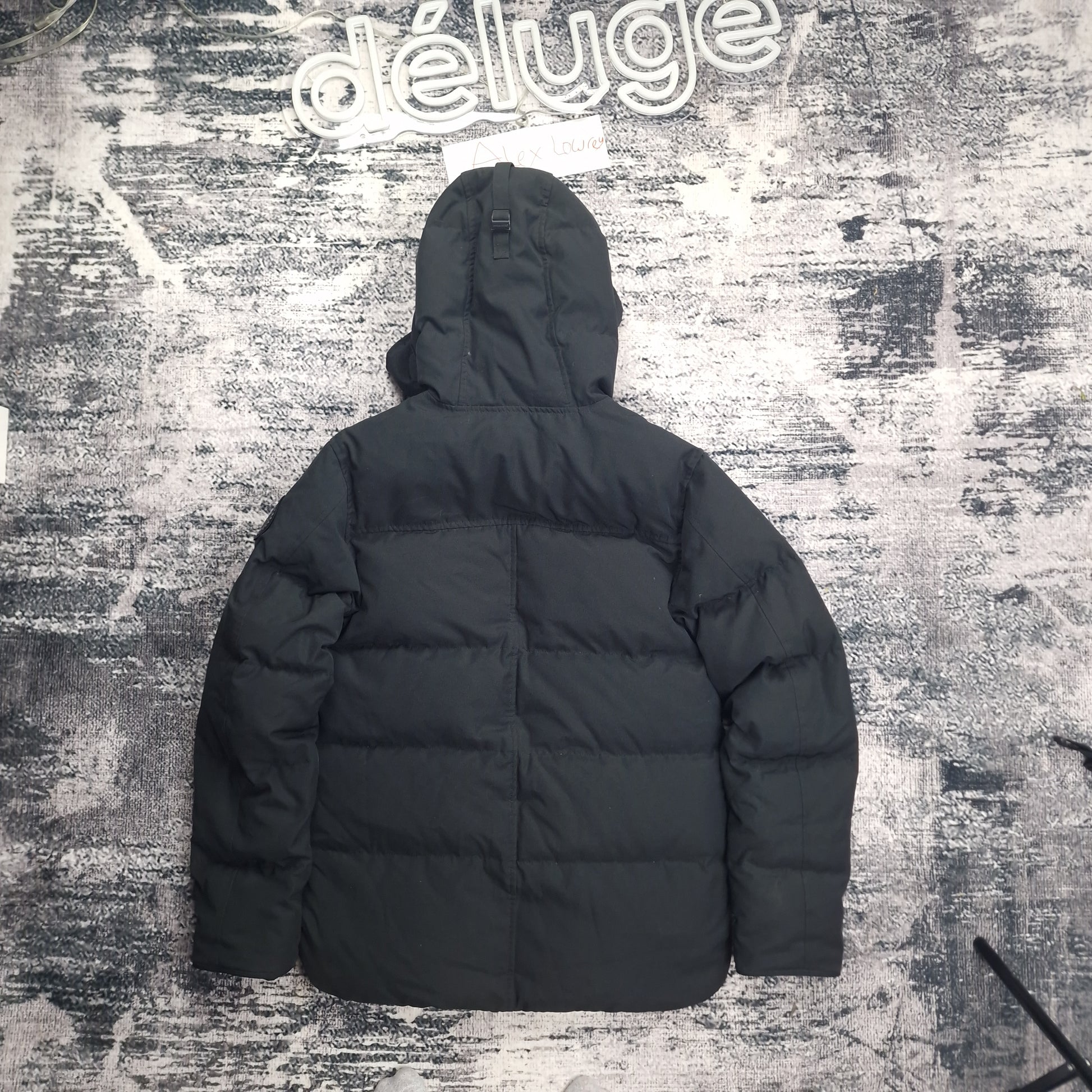 Back view flat lay of black Canada Goose Macmillan Black Label Parka 3804MB men's medium showing quilted down construction and hood