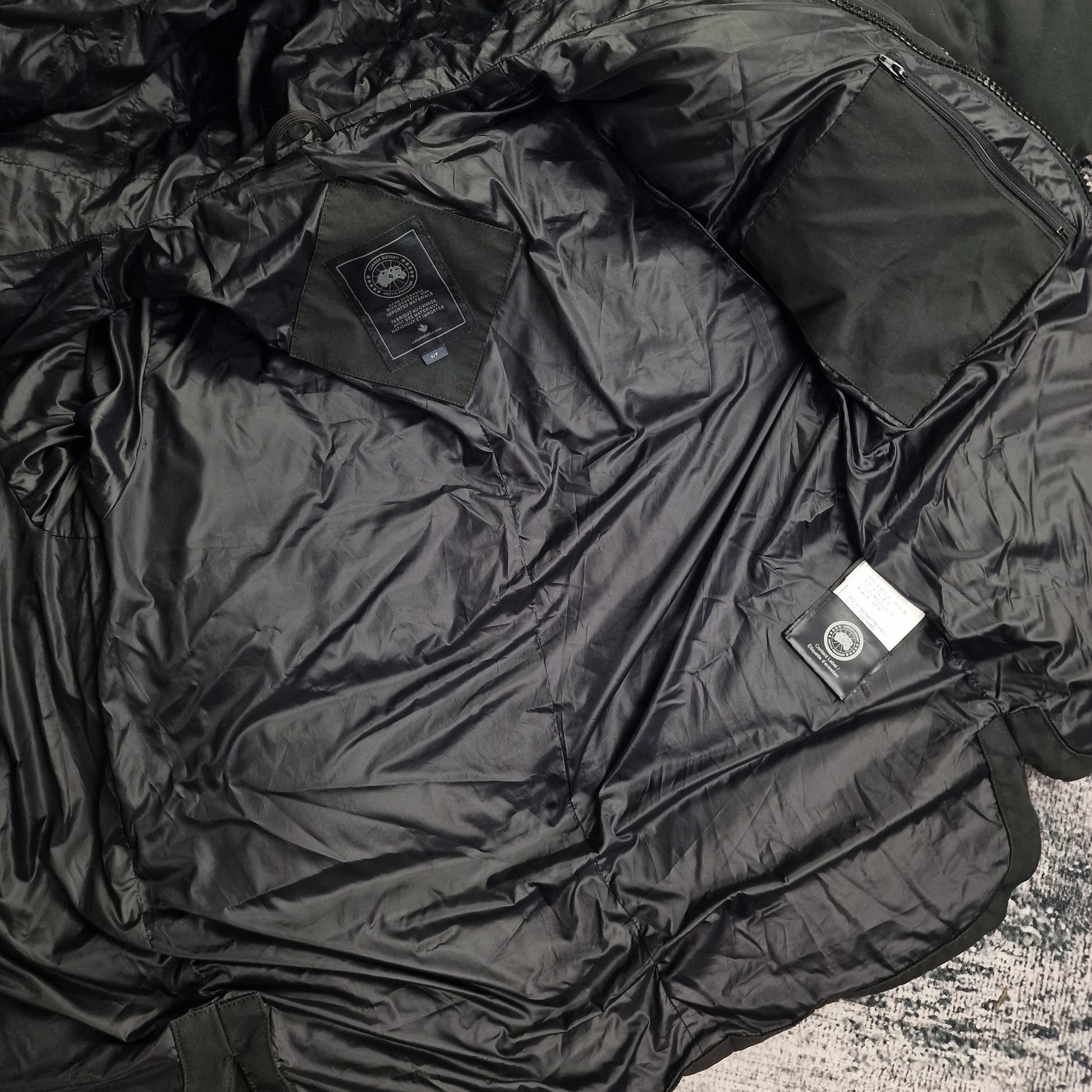Interior view of Canada Goose Macmillan Black Label Parka 3804MB showing black lining and authentic interior tags