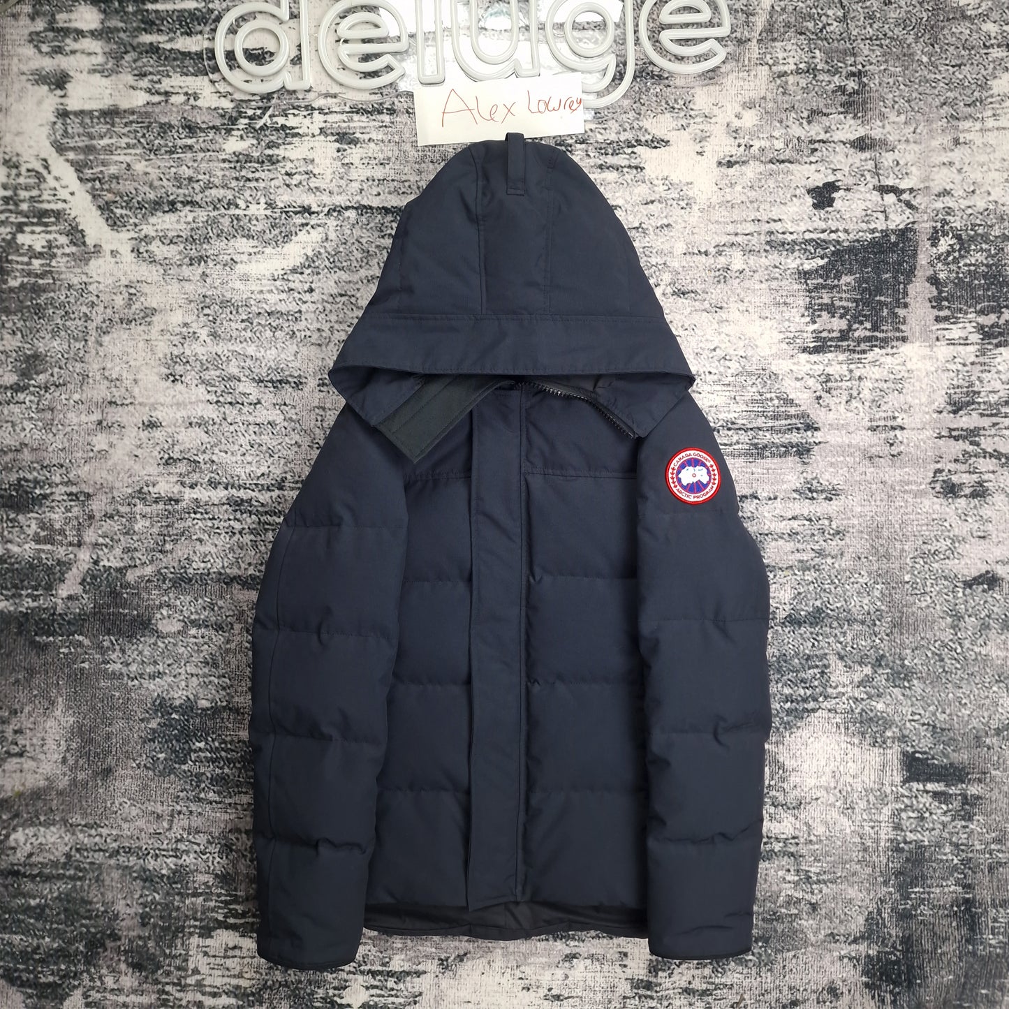 Front flat lay of Canada Goose Macmillan Parka 3804M men's XS in navy with hood and Arctic Program disc badge