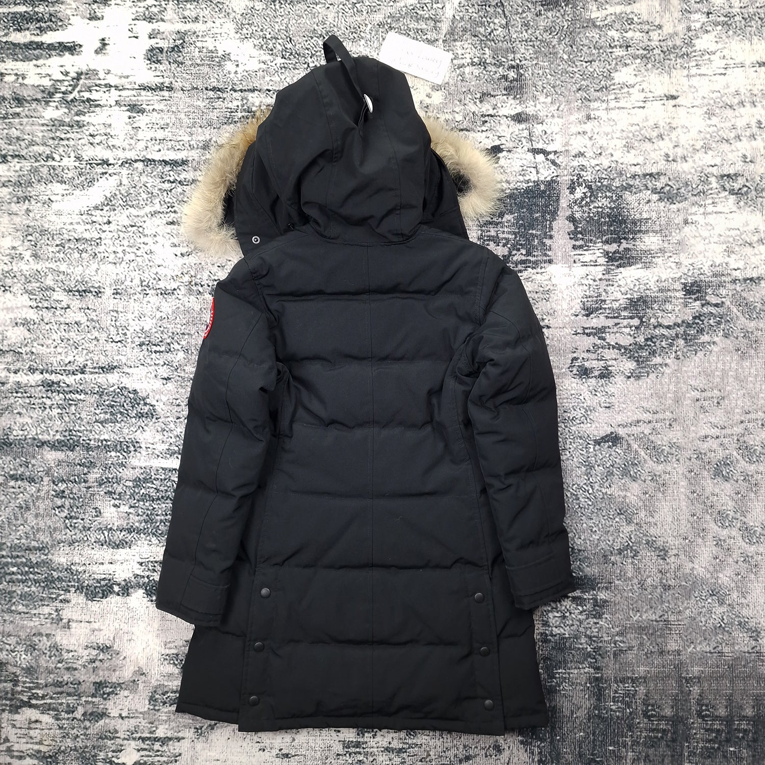 Back flat lay of Canada Goose Shelburne Parka 3802L women's small showing fur-trimmed hood and button closure detail