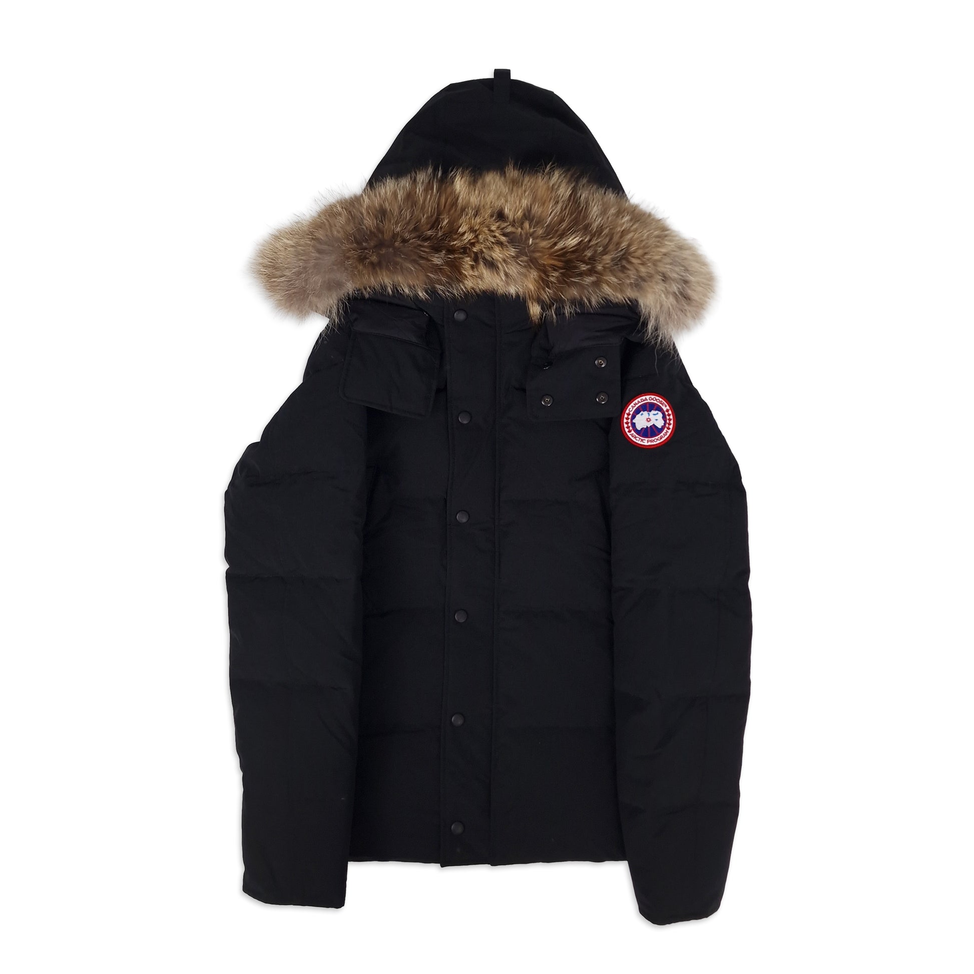 Front view of authentic Canada Goose Wyndham Heritage parka 3808MA with fur hood, men's large in black, featuring snap-button storm flap and pockets