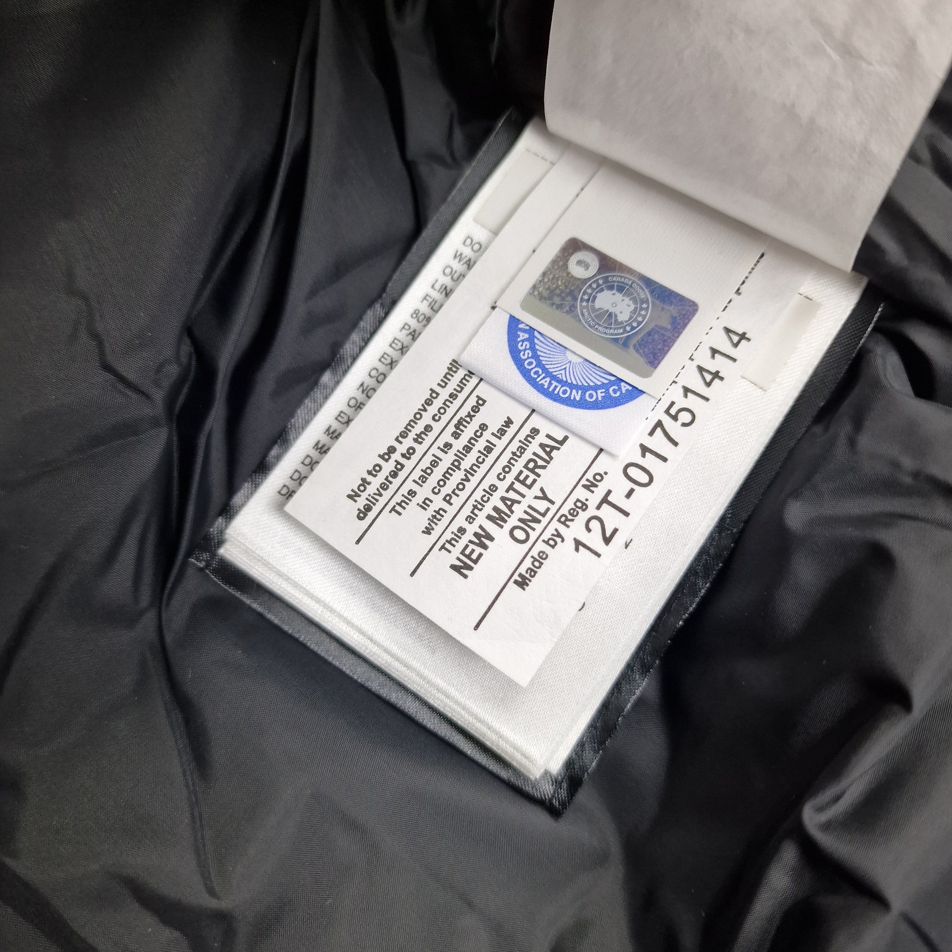 Canada Goose Authenticity Hologram and Blue Downmark Tag Close-Up on Maitland Parka