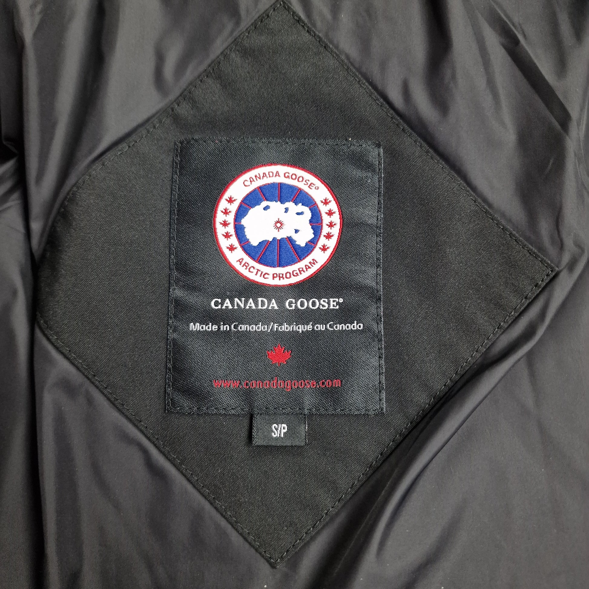 Canada Goose Portland Parka Neck Tag Close-Up Showing Size Label