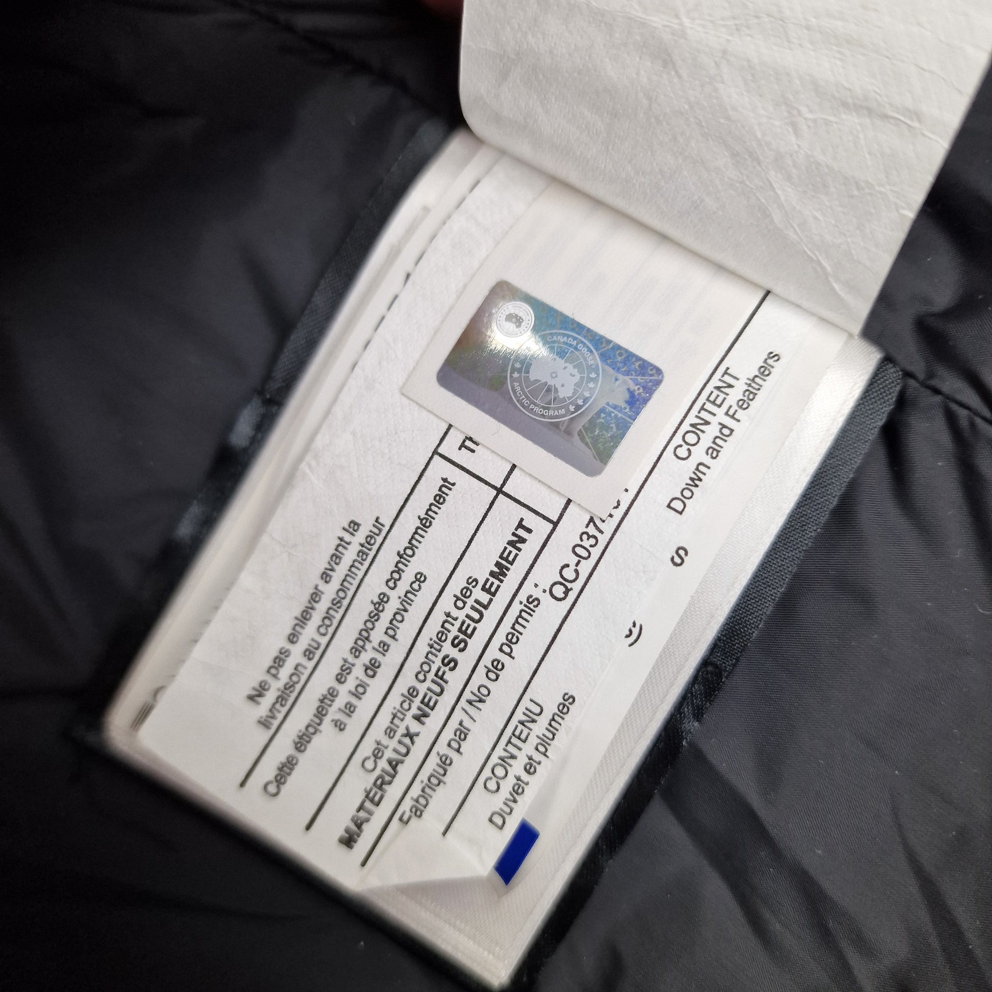 Canada Goose Authenticity Hologram Tag Close-Up on Wyndham Parka