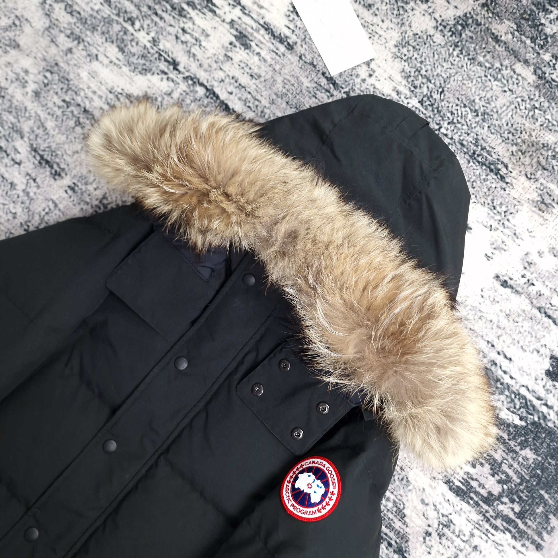 Canada Goose Wyndham Parka Black Men's Side View Showing Fur Hood and Badge Detail