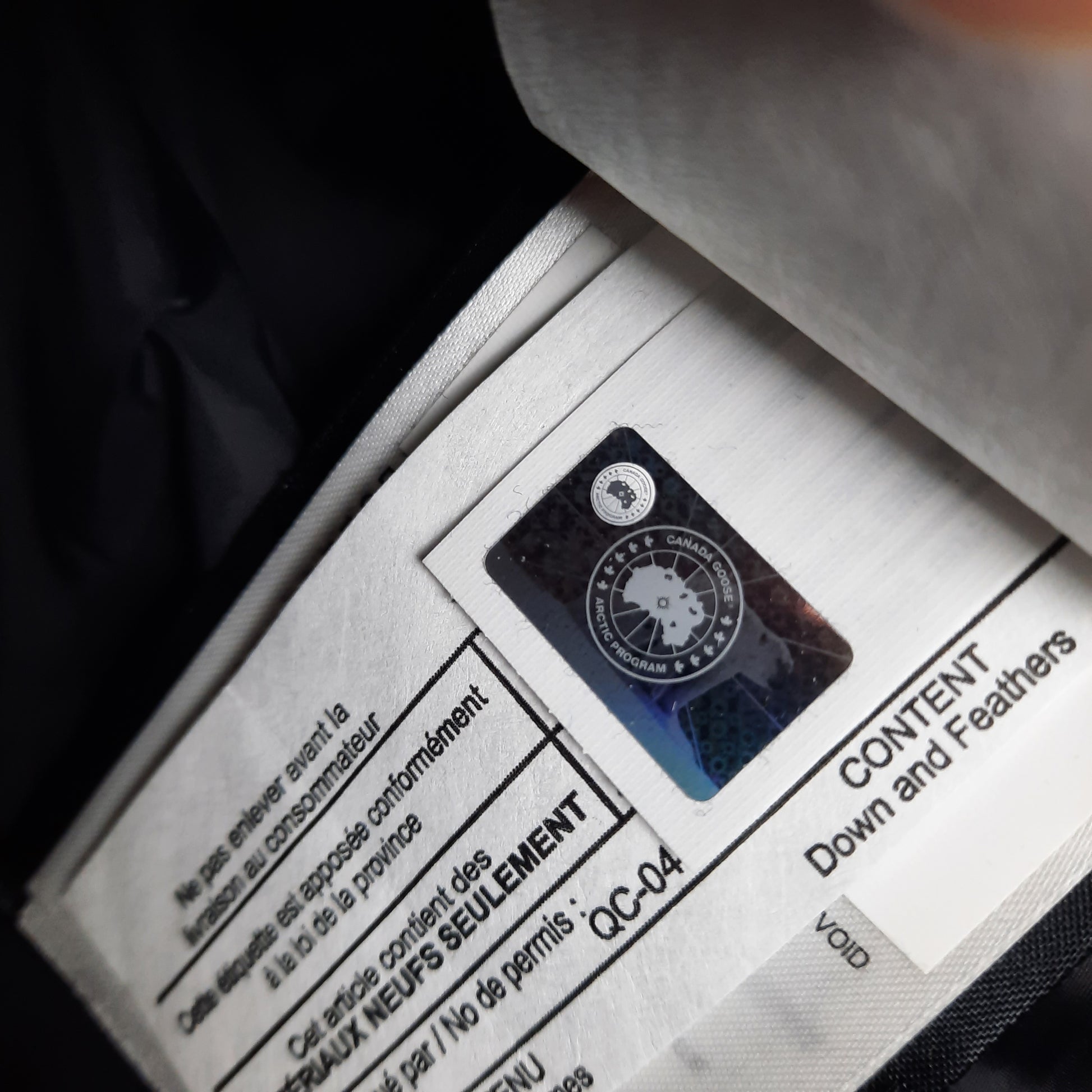 Canada Goose Authenticity Hologram Tag Close-Up on Wyndham Parka Heritage