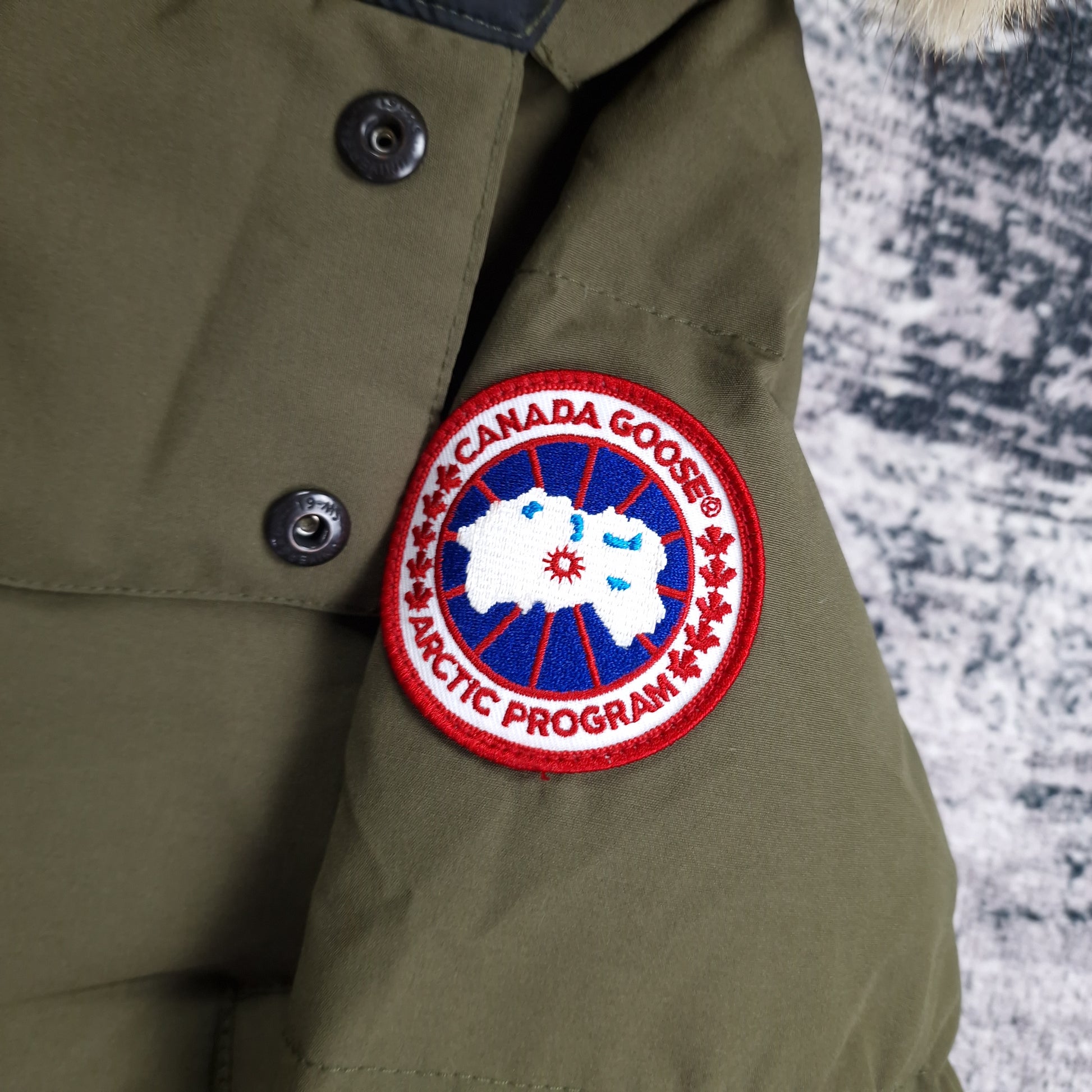 Canada Goose Badge Close-Up Detail on Wyndham Parka Heritage Military Green Men's