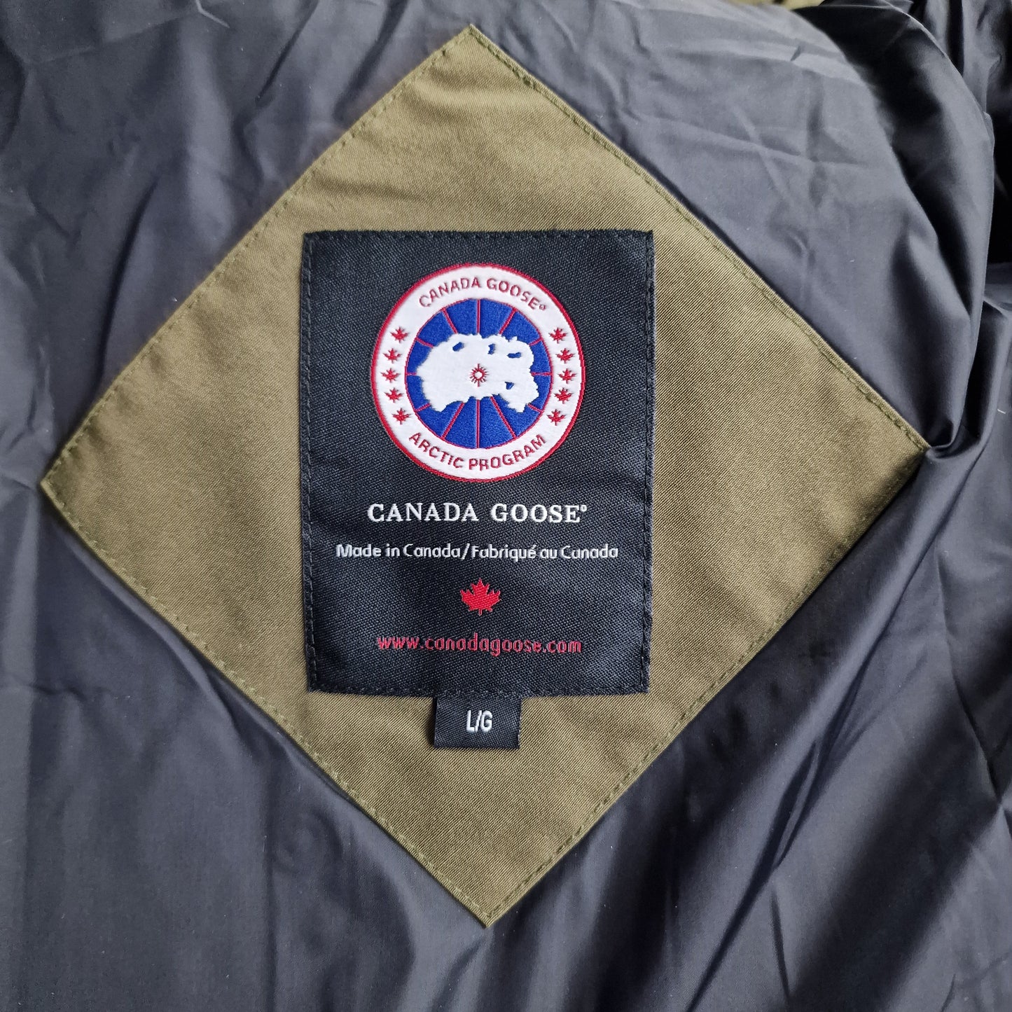 Canada Goose Wyndham Parka Heritage Neck Tag Close-Up Showing Size Label